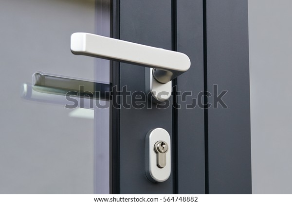 Exterior\
door handle and Security lock on Metal\
frame