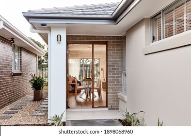 Exterior of the entrance to a granny flat studio home at the side of a house