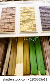 Exterior Facade Panels And Fittings For Finishing The House On Racks In A Hardware Store Sale. Materials For Repair And Construction.