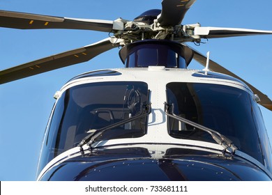 Exterior Front View Of Helicopter Cockpit And Rotor Blades