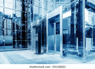 The Exterior Is A Glass Curtain Wall Elevator, Blue Tone Chart.