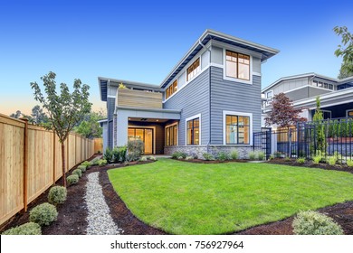 Exterior Of Grey Blue Craftsman Style Home With Welcoming Backyard And Covered Patio. Northwest, USA