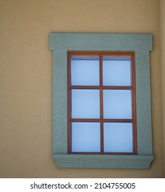 Exterior Home Window Wooden Framed Square Wooden Panels Over Glass Window Green Frame On Yellow Concrete Wall In Urban Area Vertical Format Empty Framed Space For Type Background Home Maintenance