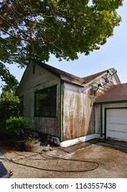 Exterior Of House Being Scraped, Sanded, Prepped And Primed For Painting In The Inland Northwest 