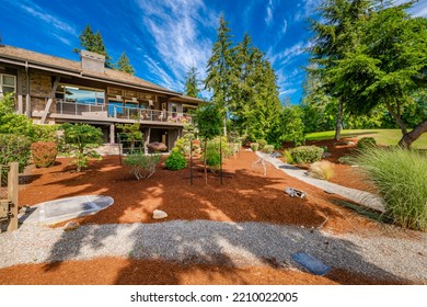 Exterior Of A Large Modern Craftsman House With Trees Landscaping And Bright Sunny Day