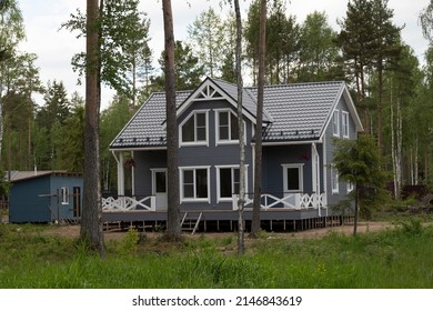 The Exterior Of Luxury Homes. Houses In The Suburbs In The Summer In The Northern Nature. A Luxurious House With A Beautiful Landscape. Country Luxury Houses Made Of Wood On The Outside. Scandinavian