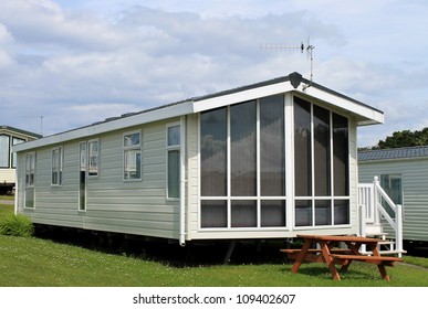 Exterior Of Modern Caravan, Trailer Or Mobile Home In Park - Generic One Available For Hire.