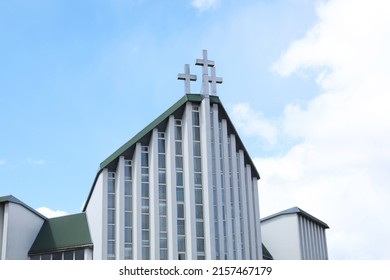 Exterior Of Modern Church Against Blue Sky With Clouds