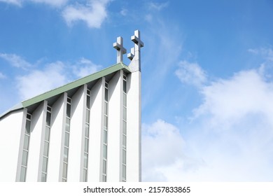 Exterior Of Modern Church Against Blue Sky With Clouds