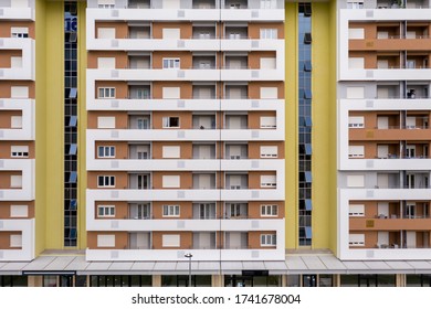 Exterior of a modern high-rise multi-story apartment building (condo) - facade, windows and balconies. 