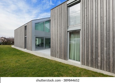 Exterior Of A Modern House In Cement And Wood, Lawn