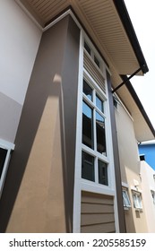 Exterior Of Modern House With Window, Roof And Ceiling And Rain Gutter.