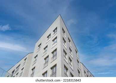 Exterior Of Modern White House, Bottom And Angle View. Architectural Detail Of Close-up On Windows. Real Estate, Residential Apartments And Offices. Living Apartments Or Office Building Architecture.