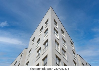 Exterior Of Modern White House, Bottom And Angle View. Architectural Detail Of Close-up On Windows. Real Estate, Residential Apartments And Offices. Living Apartments Or Office Building Architecture.