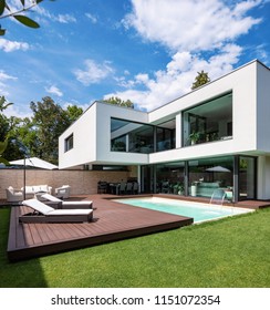 Exterior modern white villa with pool and garden, nobody inside