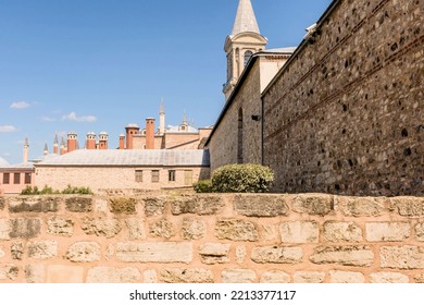 Exterior Of Mosque With Spire Against Blue Sky.