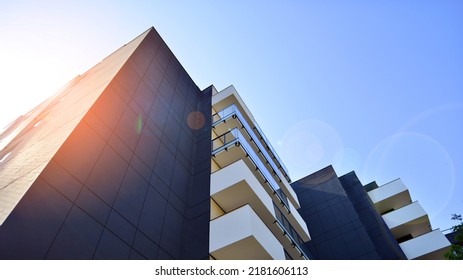 Exterior Of New Apartment Buildings On A Blue Cloudy Sky Background. No People. Real Estate Business Concept.