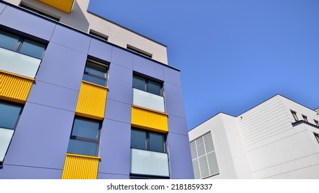 Exterior Of New Apartment Buildings On A Blue Cloudy Sky Background. No People. Real Estate Business Concept.