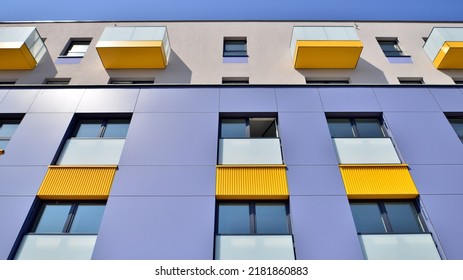 Exterior Of New Apartment Buildings On A Blue Cloudy Sky Background. No People. Real Estate Business Concept.