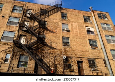 The Exterior Of Old Brick Building In Midwest Suburb.