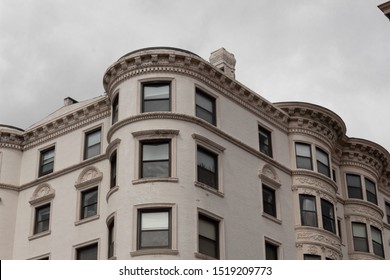 Exterior Outside Corner Of Painted Brick Apartment Building Featuring Beautiful Moulding Details, Horizontal Aspect