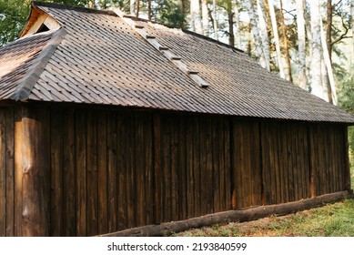 Exterior Rustic Barn Made Of Planks In The Woods Outdoors. Close-up, Side View.