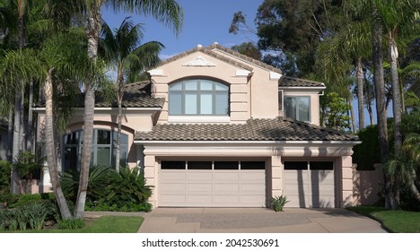 Exterior Of Typical California Luxury Home With Palm Trees