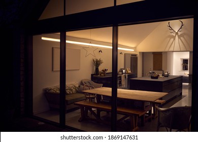 Exterior View Of Beautiful Kitchen Extension At Night