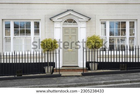 Exterior view of a beautiful old town house on a street in an English city