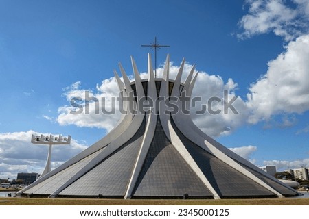 Exterior view of Brasilia Metropolitan Cathedral with clear blue winter sky on the background, under morning light.