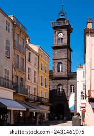 Exterior view of Clock Tower of Issoire during daytime. Puy-de-Dome department in Auvergne, central France.