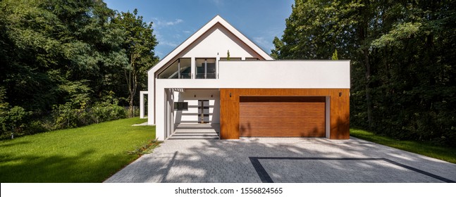 Exterior View Of Elegant House With Cobblestone Driveway, Panorama