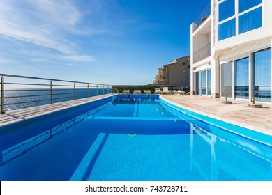 Exterior view of an expensive luxury Mediterranean villa with private swimming pool. without people