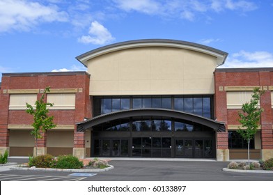 An Exterior View Of A Generic Shopping Center Store Building Outside In The Summer.