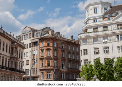 Exterior view of historical old town neighborhood buildings in the downtown of Budapest, Hungary, Eastern Europe. Colorful houses in the V. district (Szervita square), the true inner city of Pest. - Powered by Shutterstock