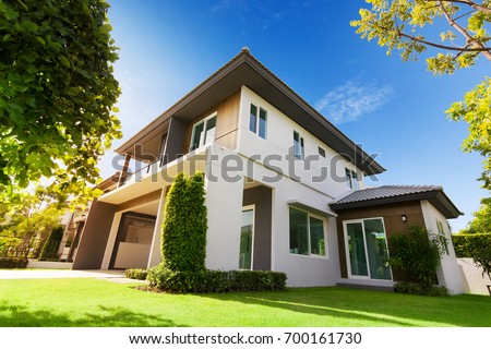 Exterior view of house with green grass.Home For Sale,Rent,Housing and Real Estate concept.