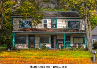 Exterior View Of A House In New England In Late September As The Trees Turn Colors.