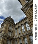 Exterior view of the Iowa State Capitol in Des Moines, featuring its iconic golden dome and historic architecture. Some images show the full building, others highlight detailed sections.