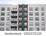 Exterior view of modern apartment building. New construction apartment or condo complex. Modern new residential apartment house building complex