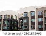 Exterior view of modern apartment building. New construction apartment or condo complex. Modern new residential apartment house building complex