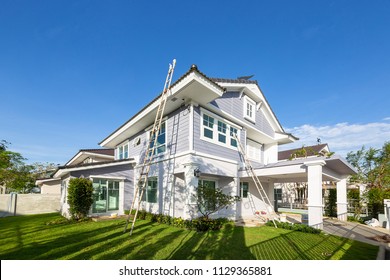 Exterior view of new house under construction and painting.Home renovation and construction concepts - Shutterstock ID 1129365881
