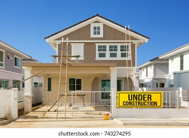 Exterior View Of New House Under Construction And Painting