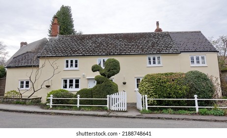 Exterior View Of An Old Cottage House On A Street In An English Town