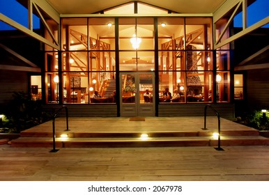 Exterior View Of Resort At Night, Looking Into Bar