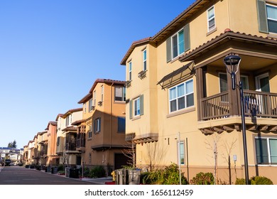Exterior view of a row of identical townhouses; Sunnyvale, San Francisco bay area, California
