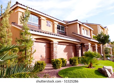 Exterior view of a stucco house - Shutterstock ID 51525286