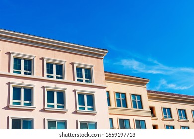 Exterior View Of Typical New Medium Rise Multifamily Residential Building Under Blue Sky. The Buildings Could Be Occupied As Rental Apartments, College Dorms, Condominiums, Assisted-living Community