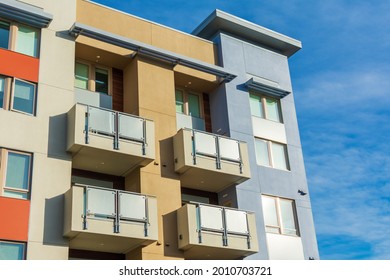 Exterior View Of Typical New Multifamily Mid-rise Residential Building With Balconies. The Buildings Usually Rental Apartments, College Dorms, Condominiums, Or Assisted-living Facilities