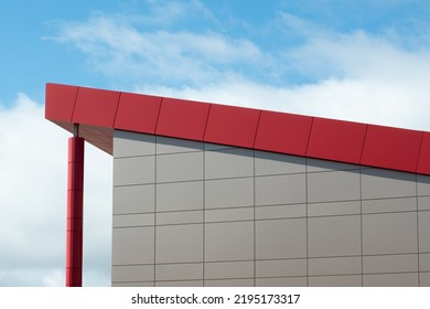 The exterior wall of a contemporary commercial style building with aluminum metal composite panels and glass windows. The futuristic building has engineered diagonal cladding steel frame panels. - Shutterstock ID 2195173317