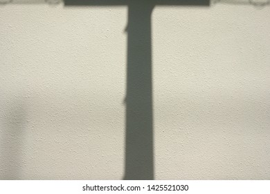  
Exterior Wall And Shadow Of Telephone Pole                              